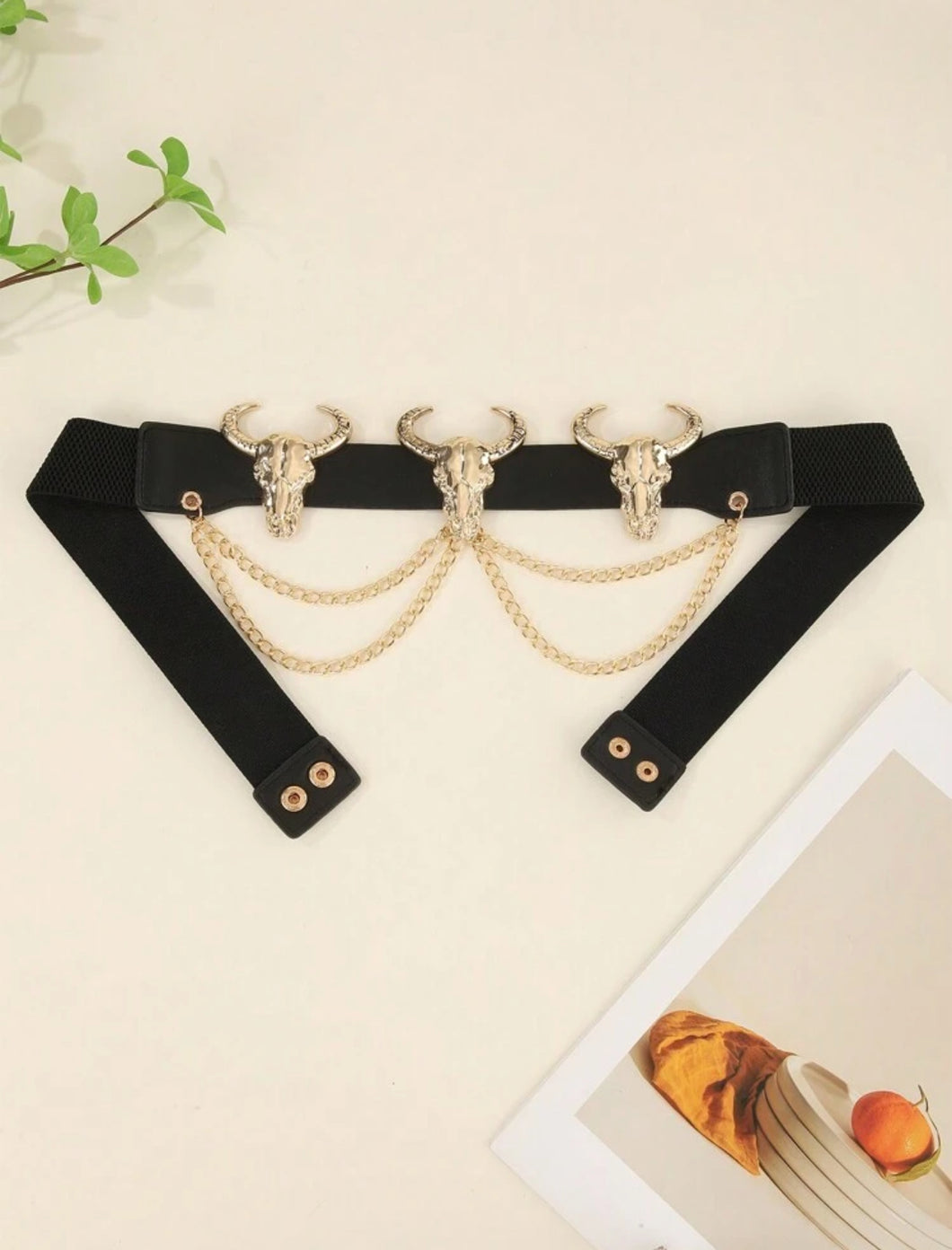 Cinturón curvy cabezas doradas