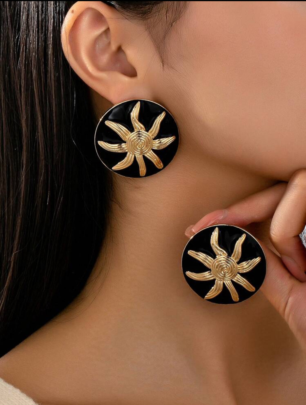 Aretes botones negros soles